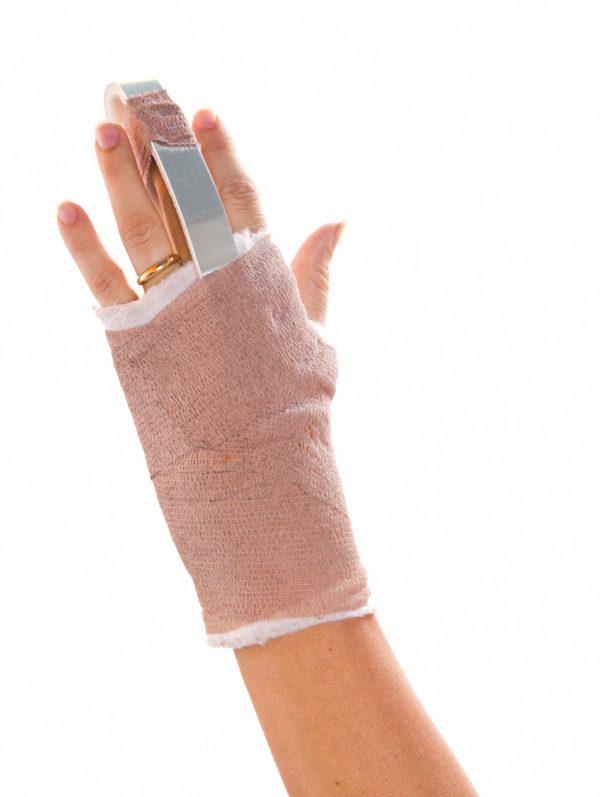A hand with wrist support after the hand surgery