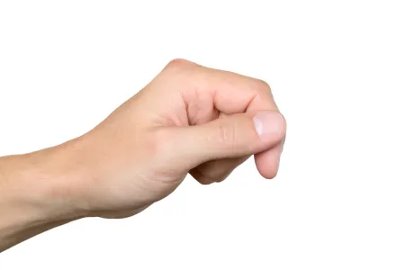 A man pointing his finger after his toe to hand surgery